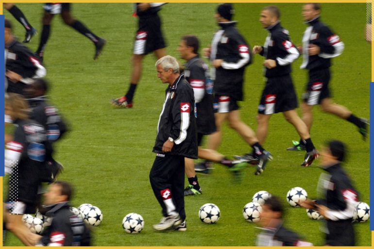 Juventus manager Marcello Lippi (C) watches his players at a practice session for the Champions League final at Old Trafford in Manchester May 27, 2003. Juventus play AC Milan in an all Italian final here on Wednesday. Pictures of the month May 2003 REUTERS/Alessandro Bianchi AB/GB