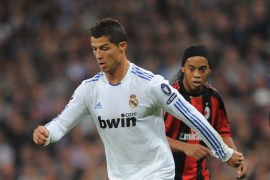 Real Madrid v AC Milan - UEFA Champions League MADRID, SPAIN - OCTOBER 19: Cristiano Ronaldo of Real Madrid dribbles with the ball while being watched by Ronaldinho of the AC Milan during the UEFA Champions League Group G match between Real Madrid and AC Milan at Estadio Santiago Bernabeu on October 19, 2010 in Madrid, Spain. (Photo by Denis Doyle/Getty Images)