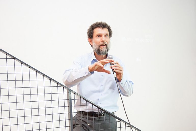 This undated handout photograph released on October 15, 2021, by the Anadolu Culture Center shows Parisian-born Turkish philanthropist Osman Kavala speaking during an event in Istanbul. - Jailed without a conviction since 2017, Turkish philanthropist Osman Kavala says he feels like a tool in President Recep Tayyip Erdogan's attempts to blame a foreign plot for domestic dissent against his mercurial rule. (Photo by Handout / Anadolu Culture Center / AFP) / RESTRICTED TO EDITORIAL USE - MANDATORY CREDIT "AFP PHOTO / ANADOLU CULTURE CENTER" - NO MARKETING - NO ADVERTISING CAMPAIGNS - DISTRIBUTED AS A SERVICE TO CLIENTS