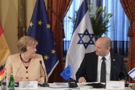 German Chancellor Angela Merkel in Israel- - JERUSALEM - OCTOBER 10: (----EDITORIAL USE ONLY – MANDATORY CREDIT - ISRAELI GOVERNMENT PRESS OFFICE (GPO) / HANDOUT" - NO MARKETING NO ADVERTISING CAMPAIGNS - DISTRIBUTED AS A SERVICE TO CLIENTS----) German Chancellor Angela Merkel (L) meets Israeli Prime Minister Naftali Bennett (R) in West Jerusalem on October 10, 2021.
