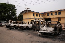 Burnt vehicles are seen outside the Nigeria police force Imo state command headquaters after gunmen attacked and set properties ablaze in Imo State