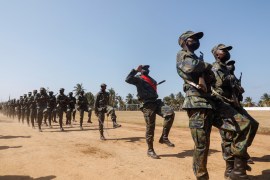 Mozambican soldiers march during Armed Forces Day celebrations in Pemba
