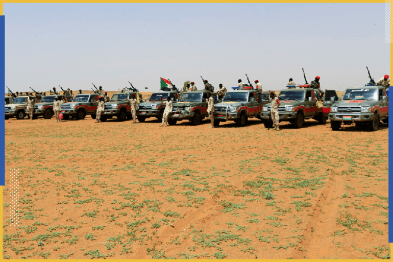 Members of Sudan's paramilitary Rapid Support Forces (RSF) stand next to vehicles during an operation to locate and arrest Irregular migrants from Ethiopia, Sudan and Chad who were abandoned by traffickers in a remote desert area near the Libyan border and taken to the Khartoum State border, Sudan September 25, 2019. REUTERS/Mohamed Nureldin Abdallah.