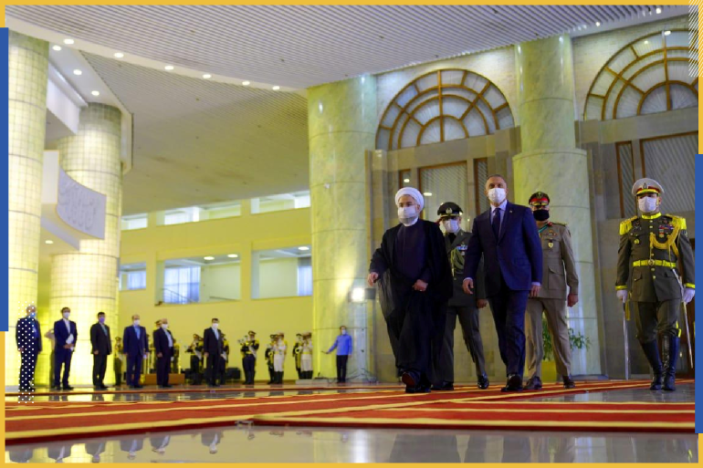 Iranian President Hassan Rouhani welcomes Iraqi Prime Minister Mustafa al-Kadhimi as they wear protective masks, in Tehran, Iran, July 21 2020. Iraqi Prime Minister Media Office/Handout via REUTERS ATTENTION EDITORS - THIS IMAGE WAS PROVIDED BY A THIRD PARTY