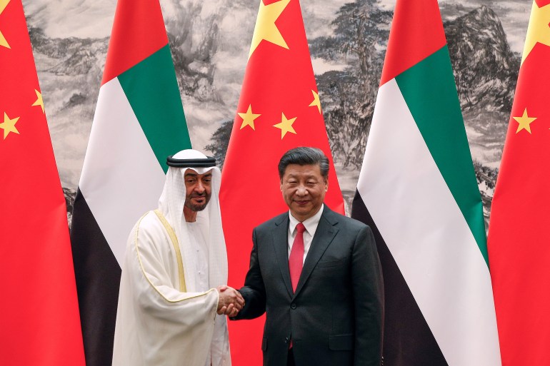 Abu Dhabi's Crown Prince Sheikh Mohammed bin Zayed Al Nahyan shakes hands with Chinese President Xi after witnessing a signing ceremony in Beijing