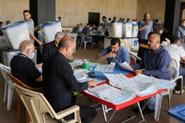 Employees of Iraq's Independent High Electoral Commission conduct a manual recount at the Green Zone in Baghdad