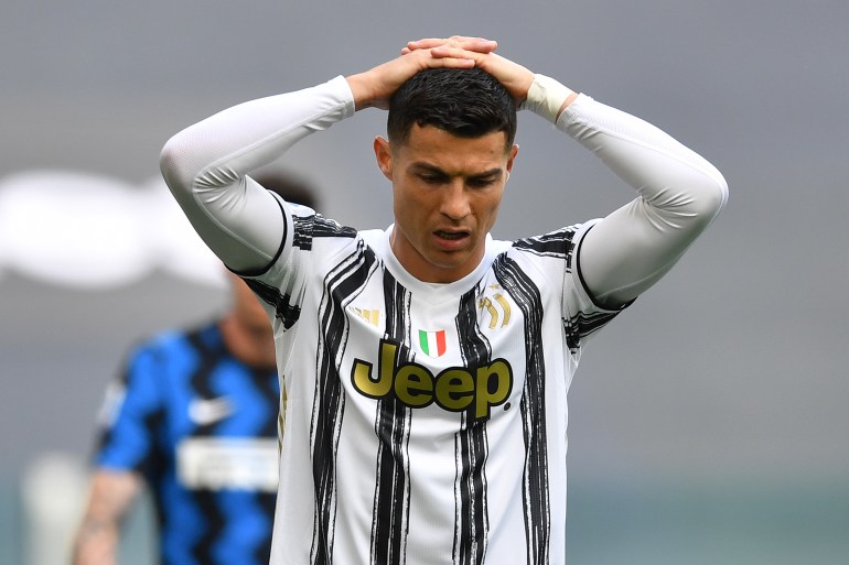 Juventus v FC Internazionale - Serie A TURIN, ITALY - MAY 15: Cristiano Ronaldo of Juventus reacts during the Serie A match between Juventus and FC Internazionale at on May 15, 2021 in Turin, Italy. Sporting stadiums around Italy remain under strict restrictions due to the Coronavirus Pandemic as Government social distancing laws prohibit fans inside venues resulting in games being played behind closed doors. (Photo by Valerio Pennicino/Getty Images)