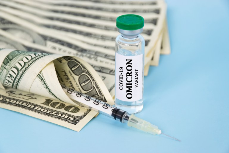 New OMICRON variant of Coronavirus COVID-19 glass, syringe and money. World prevention of pandemic and saving money for treatment. Vaccination against Corona Virus SARS-CoV-2 Omicron variant concept.
