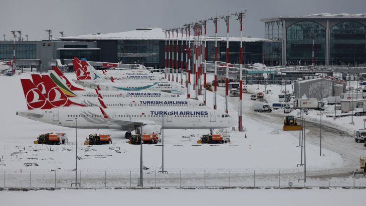 A general view of parked planes at Istanbul airport, which is suspending flights due to heavy snowfall, in Istanbul