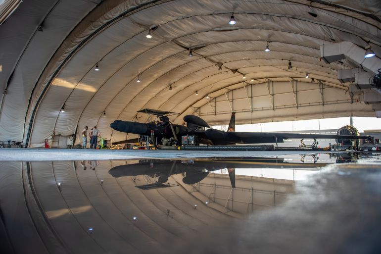 A U-2 Dragon Lady sits in a hangar prepared for flight at Al Dhafra Air Base, United Arab Emirates