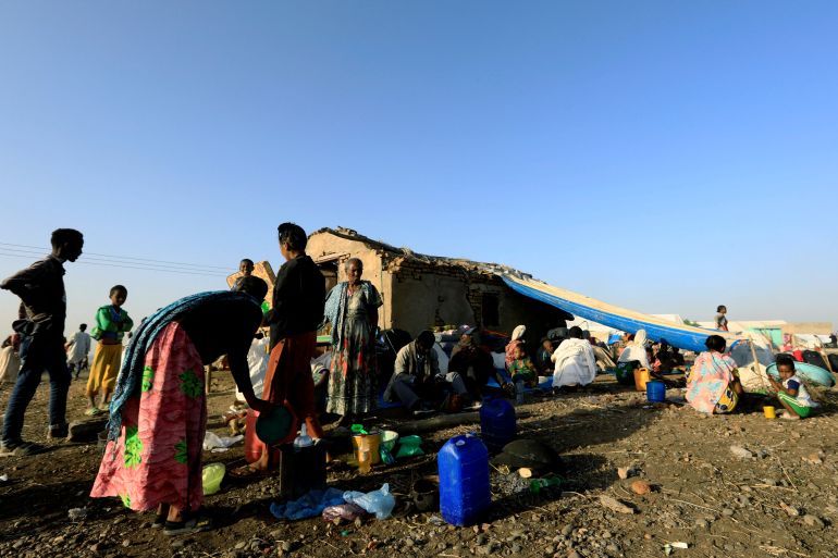 FILE PHOTO: Ethiopians who fled the ongoing fighting in Tigray region, gatherl in Hamdayet village near the Sudan-Ethiopia border, eastern Kassala state, Sudan November 22, 2020. REUTERS/Mohamed Nureldin Abdallah/File Photo
