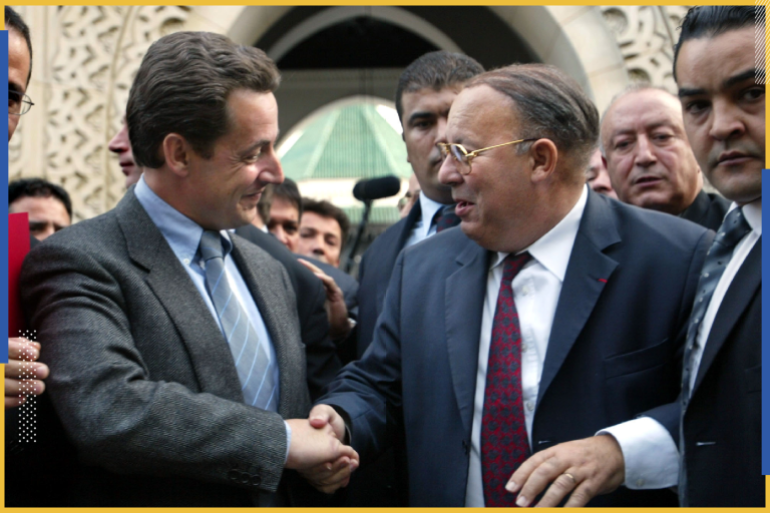 French interior Minister Nicolas Sarkozy (L) shakes hands with Dalil Boubakeur, rector of the Paris Grand Mosque, October 05, 2002. During a visit to the Grand mosque Sarkozy vowed to fight racism vigorously after two teenagers of North African origin have been killed in France October 04 and three other youths wounded in violence that shocked the nation.