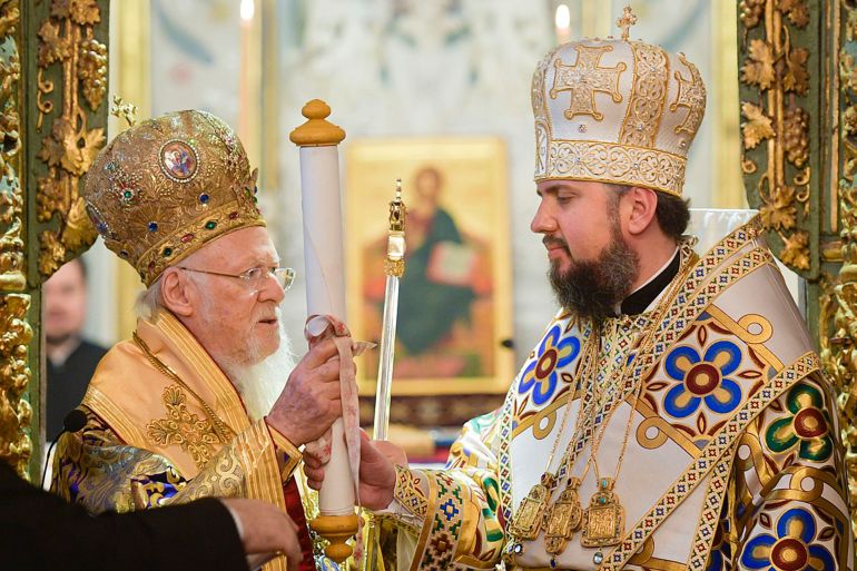Patriarch Bartholomew handing the formal signed decree to Metropolitan Epifaniy, the new leader of an autocephalous Orthodox Church of Ukraine, in January 2019.