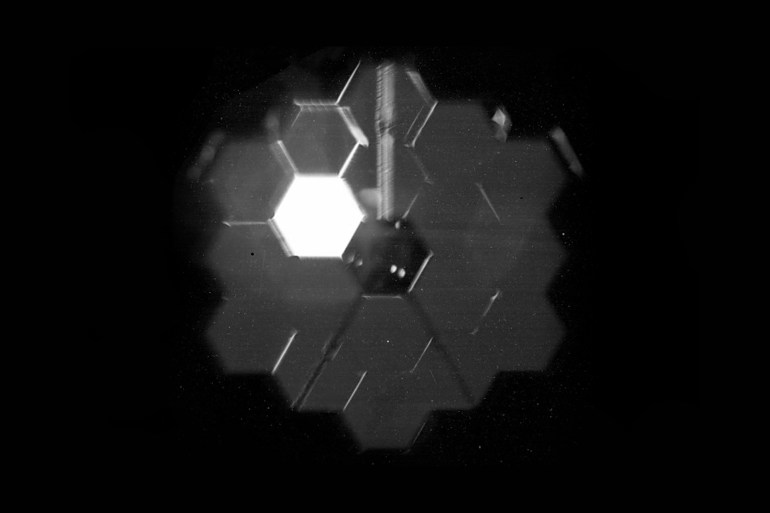 This “selfie” was created using a specialized pupil imaging lens inside of the NIRCam instrument that was designed to take images of the primary mirror segments instead of images of space. This configuration is not used during scientific operations and is used strictly for engineering and alignment purposes. In this case, the bright segment was pointed at a bright star, while the others aren’t currently in the same alignment. This image gave an early indication of the primary mirror alignment to the instrument. Credit: NASA