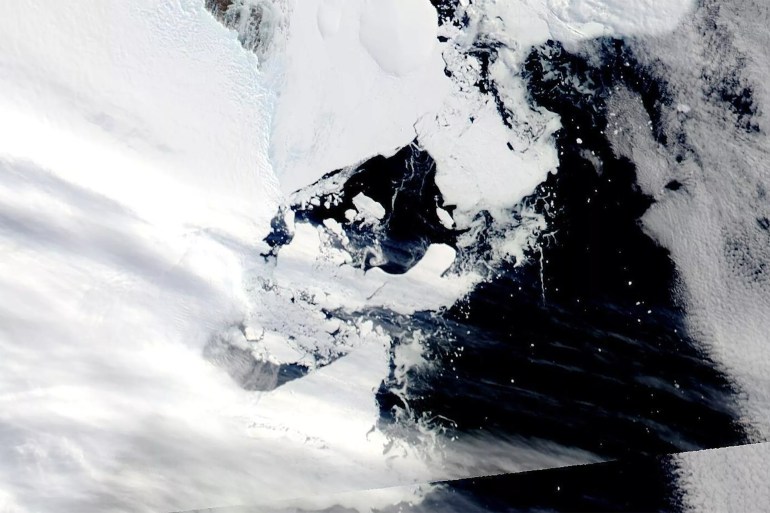 This satellite image provided by NASA shows Aqua MODIS 16 on March 2022, shows C-38 in one piece chasing the main piece of C-37 moving west on the coastal current. Scientists are concerned because an ice shelf the size of New York City collapsed in East Antarctica, an area that had long been thought to be stable. The collapse last week was the first time scientists have ever seen an ice shelf collapse in this cold area of Antarctica. (NASA via AP)
