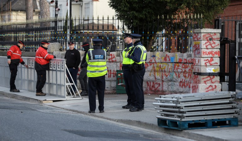 Workers assemble security barriers at the Russian Embassy in Dublin