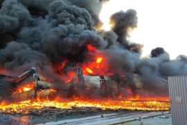 A warehouse with household goods is seen on fire after shelling in Sumy