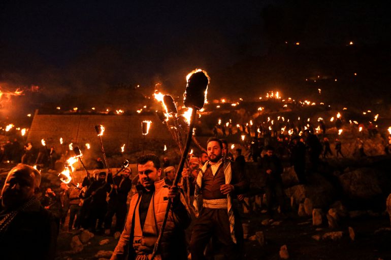People celebrate Nowruz Day, in the town of Akra