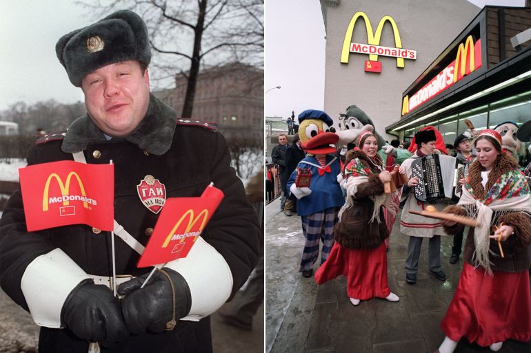 A Soviet customer of the just opened first McDonald's in the Soviet Union holds little flags of the US fast food enterprise on January 31, 1990 at Moscow's Pushkin Square. AFP PHOTO VITALY ARMAND (Photo by VITALY ARMAND / AFP)