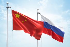 3D Rendering of China &amp; Russia Flags are Waving in the Sky - 3d illustration; Shutterstock ID 1373485424; purchase_order: ajnet; job: ; client: ; other: