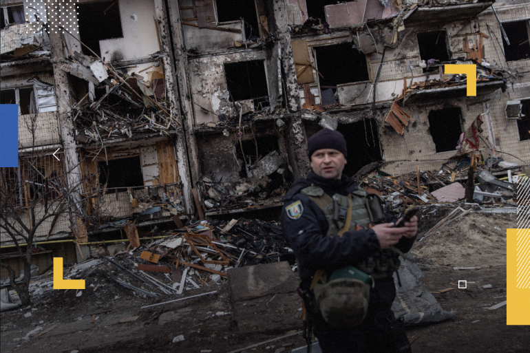 KYIV, UKRAINE - FEBRUARY 25: A Ukrainian police officer stands in front of a damaged residential block hit by an early morning missile strike on February 25, 2022 in Kyiv, Ukraine. Yesterday, Russia began a large-scale attack on Ukraine, with Russian troops invading the country from the north, east and south, accompanied by air strikes and shelling. The Ukrainian president said that at least 137 Ukrainian soldiers were killed by the end of the first day. (Photo by Chris McGrath/Getty Images)