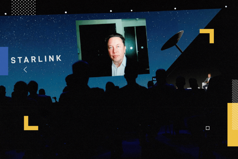 Elon Musk speaks on a screen during the Mobile World Congress