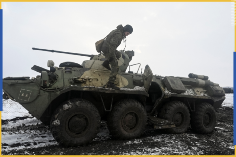 A Russian army service member gets off an armoured personnel carrier BTR-82 during drills at the Kuzminsky range in the southern Rostov region, Russia January 26, 2022. REUTERS/Sergey Pivovarov