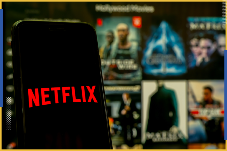 Phitsanulok Thailand - January 17, 2021: Hand holding martphone with logo Netflix on iphone. Application Netflix is ​​an international service provider of streaming TV series and movies.