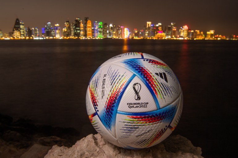 72nd FIFA World Cup Qatar 2022 Final Draw - Previews DOHA, QATAR - MARCH 31: In this photo illustration an official FIFA World Cup Qatar 2022 ball sits on display in front of the skyline of Doha ahead of the FIFA World Cup Qatar 2022 draw on March 31, 2022 in Doha, Qatar. (Photo by David Ramos/Getty Images)