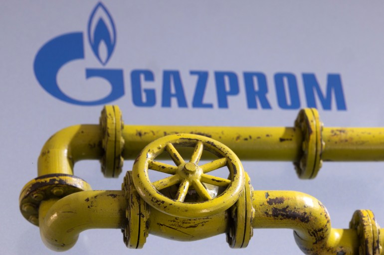 3D printed Natural Gas Pipes are placed on displayed Gazprom logo in this illustration taken, January 31, 2022. REUTERS/Dado Ruvic/Illustration