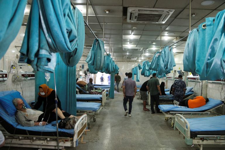 Iraqi people receive oxygen at a hospital during a sandstorm in Baghdad