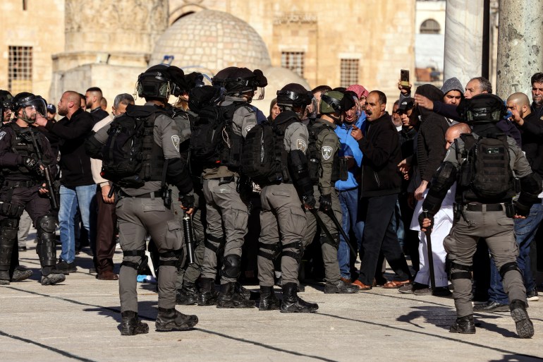 Israeli security forces argue with Palestinians during clashes with protestors at the compound that houses Al-Aqsa Mosque, known to Muslims as Noble Sanctuary and to Jews as Temple Mount, in Jerusalem's Old City
