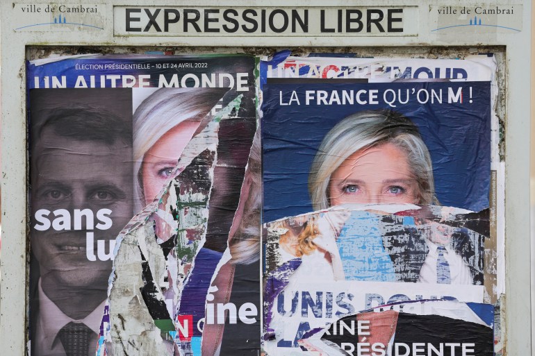 A torn poster in support of Marine Le Pen, leader of French far-right National Rally (Rassemblement National) party is pictured on a free billboard in Cambrai