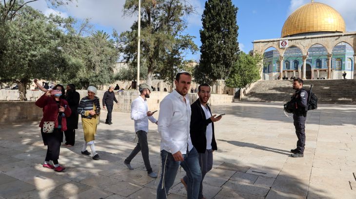 Jews are escorted by Israeli police during a visit to the compound known to Muslims as Noble Sanctuary and to Jews as Temple Mount in Jerusalem's Old City