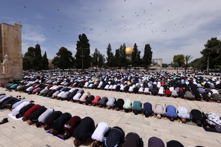 People pray at the compound that houses Al-Aqsa Mosque