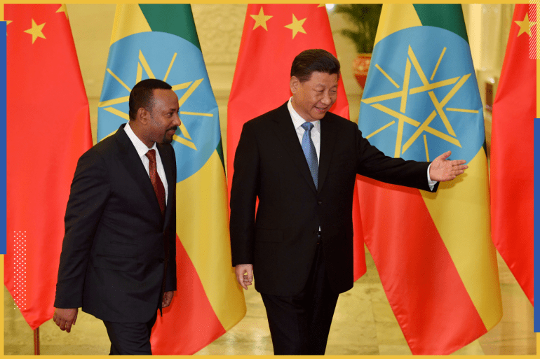 Ethiopia's Prime Minister Abiy Ahmed (L) is shown the way by Chinese President Xi Jinping before their meeting at the Great Hall of the People in Beijing, China, April 24, 2019. Parker Song/Pool via REUTERS
