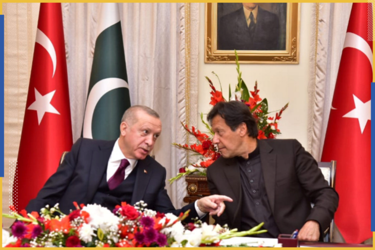 Pakistan's Prime Minister Imran Khan (R) and Turkish President Tayyip Erdogan share light moment during an agreement signing ceremony in Islamabad, Pakistan, February 14, 2020. Prime Minister's Office/Handout via REUTERS ATTENTION EDITORS - THIS PICTURE WAS PROVIDED BY A THIRD PARTY.