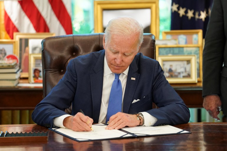President Biden signs into law S. 3522, "Ukraine Democracy Defense Lend-Lease Act of 2022" in Washington
