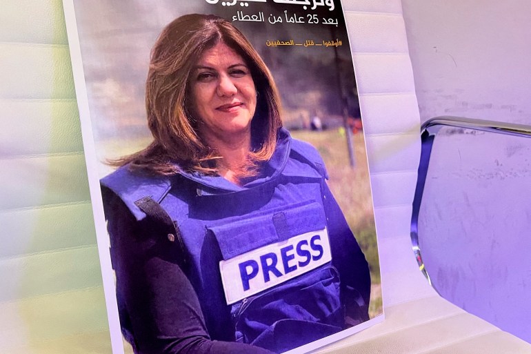 A picture of Al Jazeera reporter Shireen Abu Akleh, who was killed by Israeli army gunfire during an Israeli raid, according to the Qatar-based news channel, is displayed, in Doha
