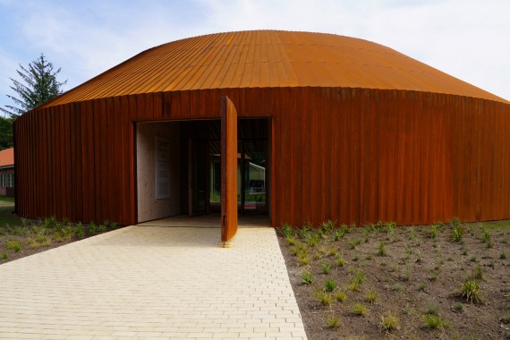 A photo taken on June 25, 2022 shows an exterior view of the new Refugee Museum of Denmark FLUGT in Oksboel, southwestern Denmark, on the day of its inauguration. - As the Second World War drew to a bloody close, facing the approaching Russian Red Army, hundreds of thousands of Germans fled their homes. Around 35,000 found their way to a refugee camp in Oksbøl, a small Danish town on Jutlands west coast, instantly making the site Denmarks fifth largest city by population size. Nowadays, little of the camp remains, aside from two former hospital buildings and a cemetery, hidden amidst a thick, green forest. But now, a new 16 million-euro refugee museum built at the site is shining fresh light on personal stories of forced migration, past and present. The new FLUGT - which means flee in Danish - Refugee Museum of Denmark opens to the public on Wednesday, June 29, 2022. (Photo by James Brooks / AFP)