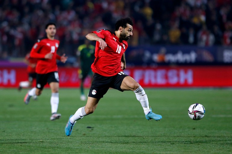Egypt v Senegal - FIFA World Cup Qatar 2022 Qualifier CAIRO, EGYPT - MARCH 25: Mohamed Salah of Egypt in action during the FIFA World Cup Qatar 2022 qualification match between Egypt and Senegal at Cairo International Stadium on March 25, 2022 in Cairo, Egypt. (Photo by Mohamed Hossam/Getty Images)