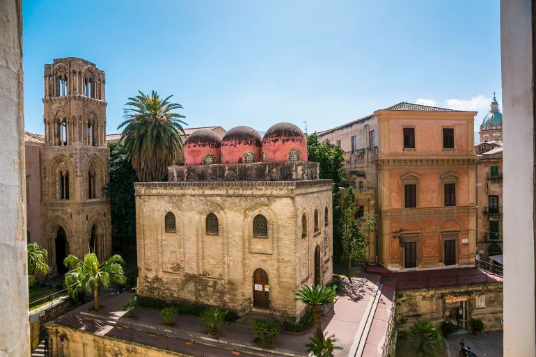 On the right, San Cataldo Church, 12th century . On the left, Santa Maria dell Ammiraglio or La Martorana Church. Piazza Bellini Square. Palermo. Sicily. Italy