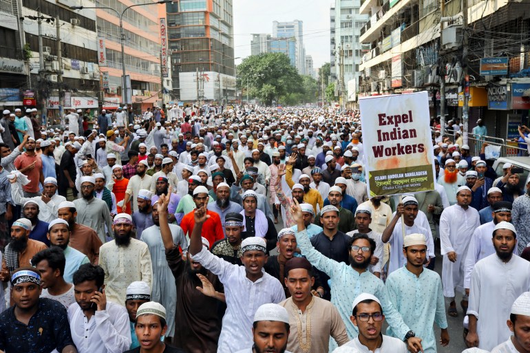 Muslims take part in a procession to protest against the blasphemous comments on Prophet Mohammed by the members of the Indian Bharatiya Janata Party, in Dhaka