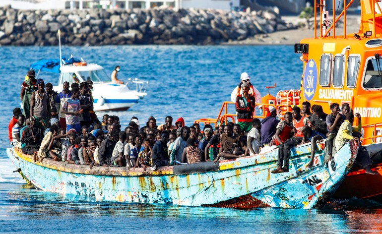Migrants disembark in the port of Arguineguin