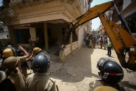 Heavy equipment is used to demolish the house of a Muslim man that Uttar Pradesh state authorities accuse of being involved in riots last week, that erupted following comments about the Prophet Mohammed by India's ruling Bharatiya Janata Party (BJP) members, in Prayagraj, India, June 12, 2022. Authorities claim the house was illegally built. REUTERS/Ritesh Shukla