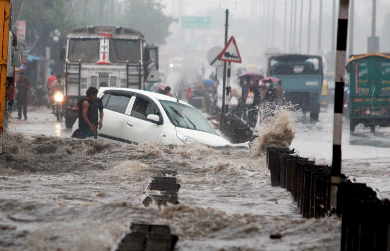 impact of climate change. After heavy rain waterlogging like flood on delhi - gurgaon - jaipur expressway in Millennium City Gurgaon. Haryana, India. August 21, 2021.; Shutterstock ID 2028619256; purchase_order: ajnet; job: ; client: ; other: