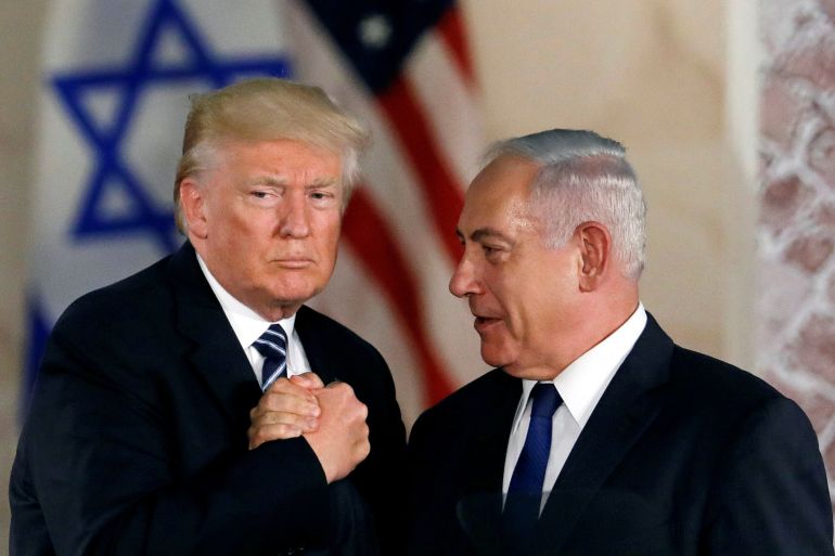 FILE PHOTO: U.S. President Donald Trump and Israeli Prime Minister Benjamin Netanyahu shake hands after Trump's address at the Israel Museum in Jerusalem May 23, 2017. REUTERS/Ronen Zvulun /File Photo