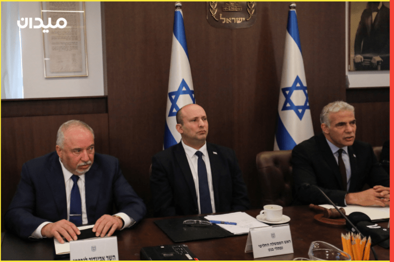 Israel's Finance Minister Avigdor Lieberman, former Prime Minister Naftali Bennett and interim Prime Minister Yair Lapid attend the first cabinet meeting days after lawmakers dissolved parliament, in Jerusalem July 3, 2022. Gil Cohen-Magen/Pool via REUTERS