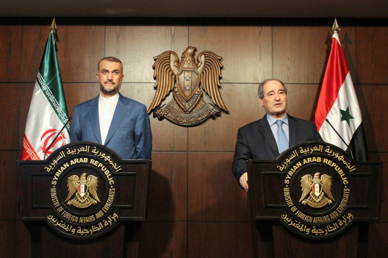 Syria's Foreign Minister Faisal Mekdad and Iran's Foreign Minister Hossein Amir-Abdollahian attend a news conference in Damascus