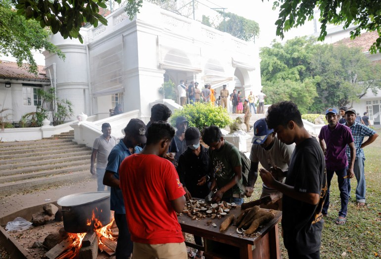 Demonstrators enter the Prime Minister's residence, in Colombo